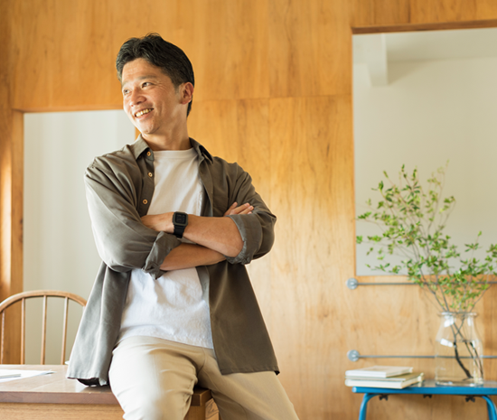 The Innovative Investor Man sitting on desk looking out