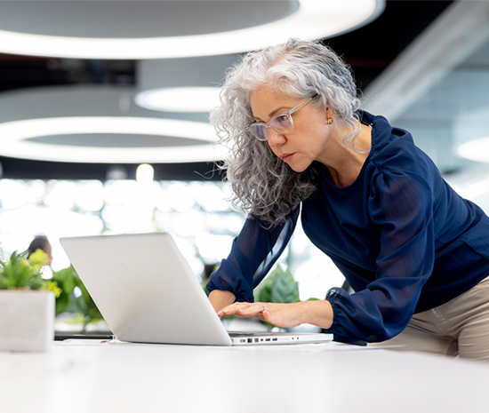 The Annual Gifter Women leaned over labtop